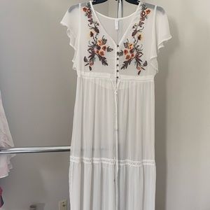 Sheer white top or swim suit cover up.